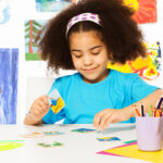 A child uses flashcards during an ABA therapy session, an important ABA technique for nonverbal children with autism.