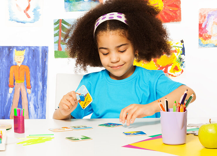 A child uses flashcards during an ABA therapy session, an important ABA technique for nonverbal children with autism.